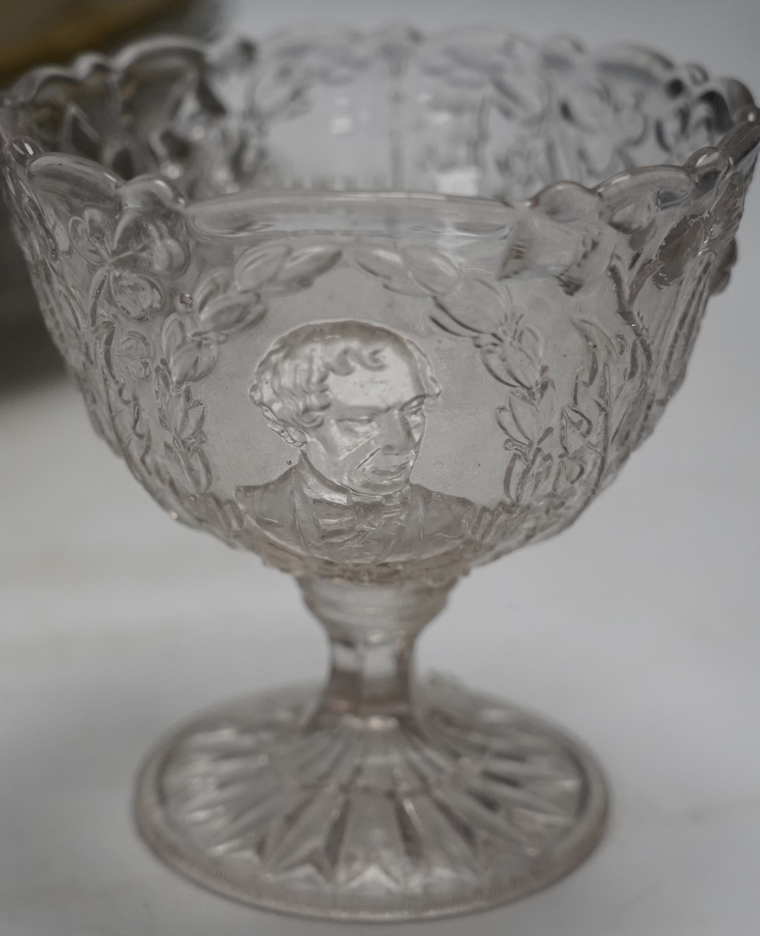 Nine pieces of Royal and other commemorative press moulded glass, Victorian to George VI, largest 30cm